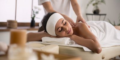 back-massage-nice-pretty-young-woman-enjoying-relaxing-massage-while-visiting-spa-salon_259150-27194